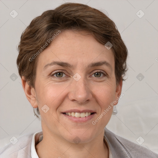 Joyful white adult female with short  brown hair and grey eyes