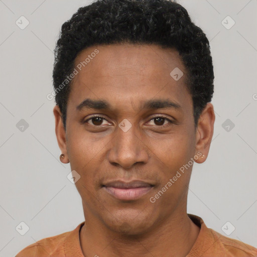 Joyful black young-adult male with short  black hair and brown eyes