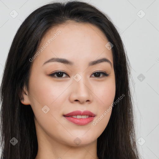 Joyful asian young-adult female with long  brown hair and brown eyes