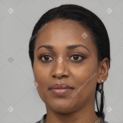 Joyful black young-adult female with medium  black hair and brown eyes