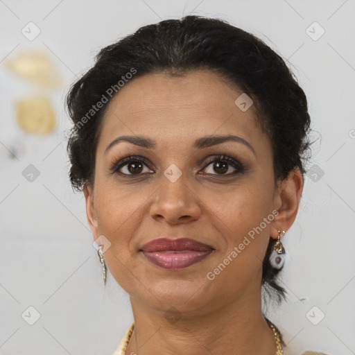 Joyful latino adult female with medium  brown hair and brown eyes