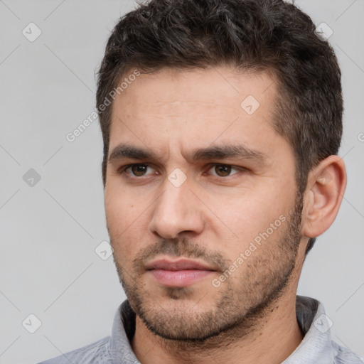 Neutral white young-adult male with short  brown hair and brown eyes