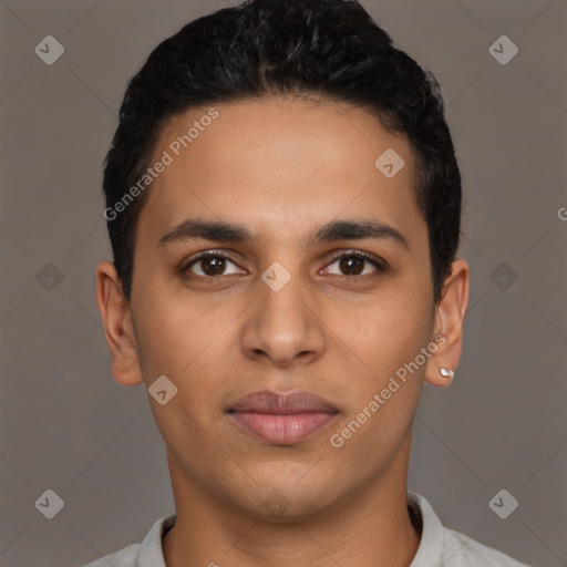 Joyful latino young-adult male with short  brown hair and brown eyes