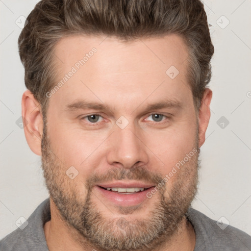 Joyful white adult male with short  brown hair and brown eyes