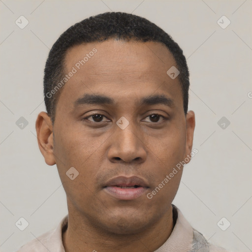 Neutral latino young-adult male with short  black hair and brown eyes