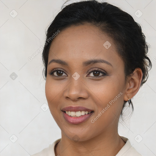 Joyful latino young-adult female with long  brown hair and brown eyes