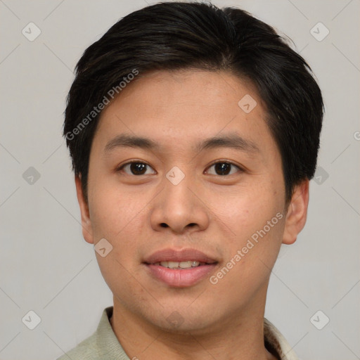 Joyful asian young-adult male with short  brown hair and brown eyes