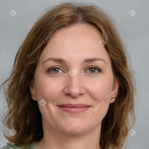 Joyful white adult female with medium  brown hair and grey eyes