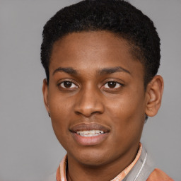 Joyful latino young-adult male with short  brown hair and brown eyes