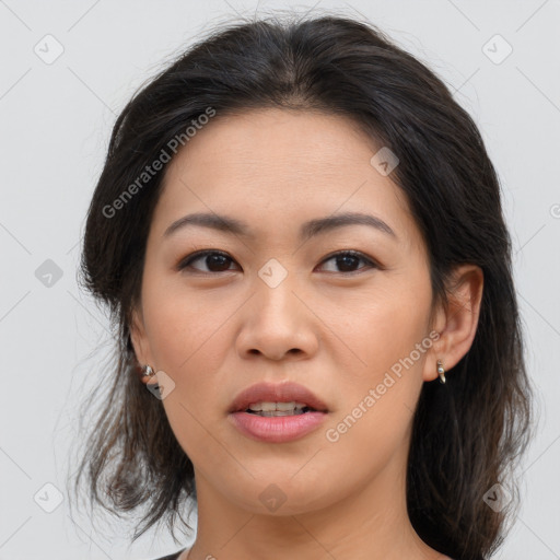 Joyful asian young-adult female with medium  brown hair and brown eyes