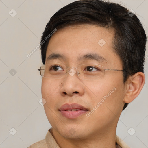 Joyful asian adult male with short  brown hair and brown eyes