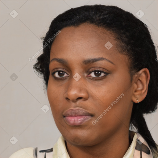 Joyful black young-adult female with medium  black hair and brown eyes