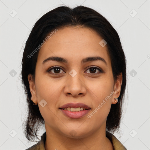 Joyful latino young-adult female with medium  brown hair and brown eyes