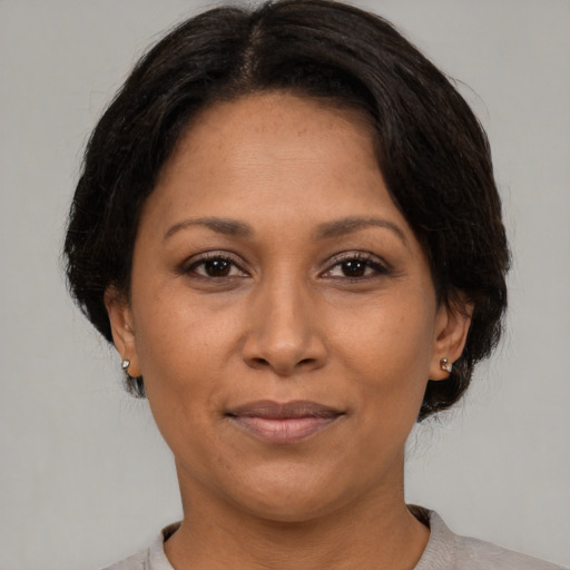 Joyful asian adult female with medium  brown hair and brown eyes