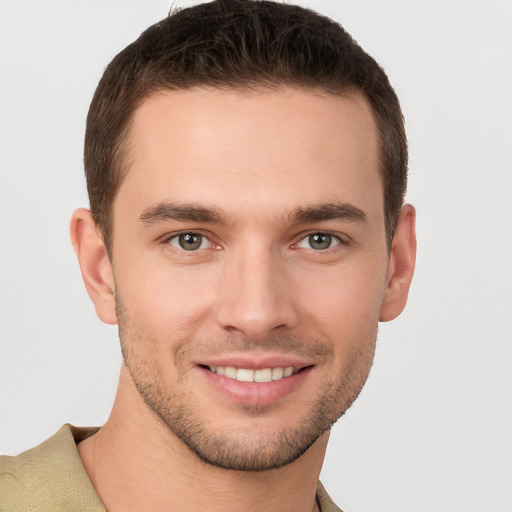 Joyful white young-adult male with short  brown hair and brown eyes