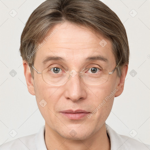 Joyful white adult male with short  brown hair and grey eyes