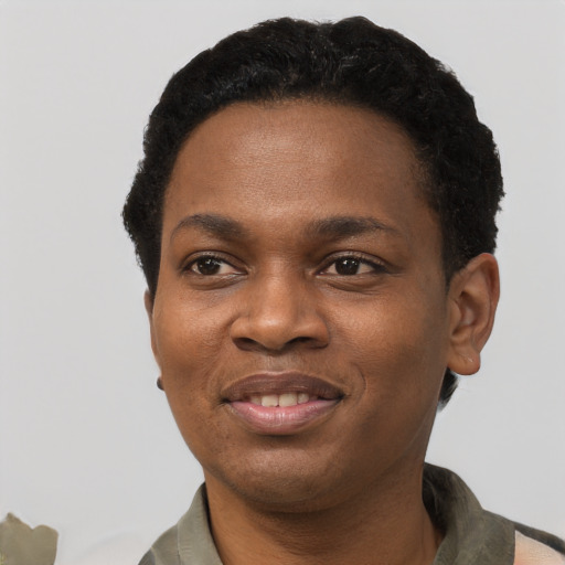 Joyful black young-adult female with short  black hair and brown eyes