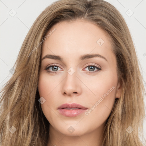 Neutral white young-adult female with long  brown hair and brown eyes