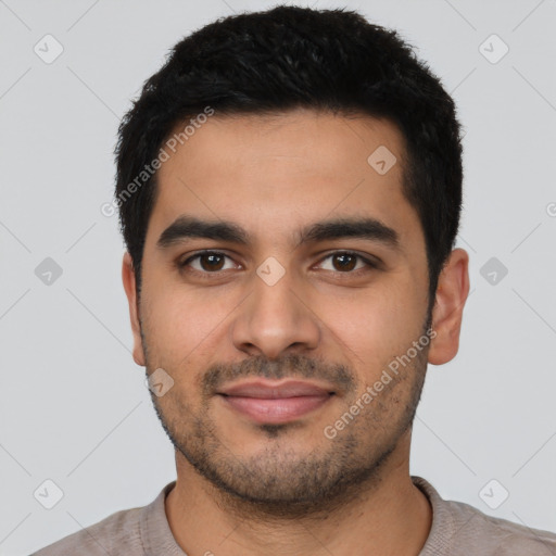 Joyful latino young-adult male with short  black hair and brown eyes