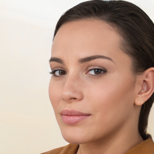 Neutral white young-adult female with long  brown hair and brown eyes