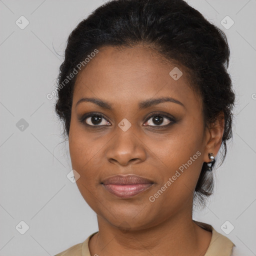 Joyful black young-adult female with long  brown hair and brown eyes