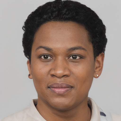 Joyful black young-adult female with short  black hair and brown eyes