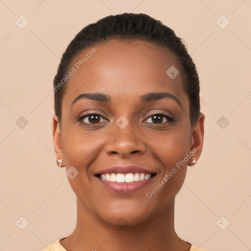 Joyful latino young-adult female with short  black hair and brown eyes