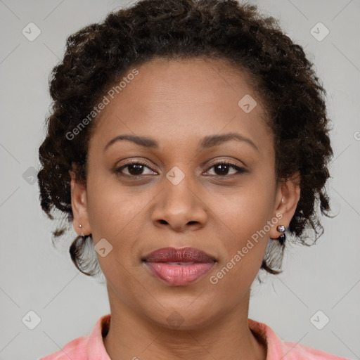 Joyful black young-adult female with medium  brown hair and brown eyes