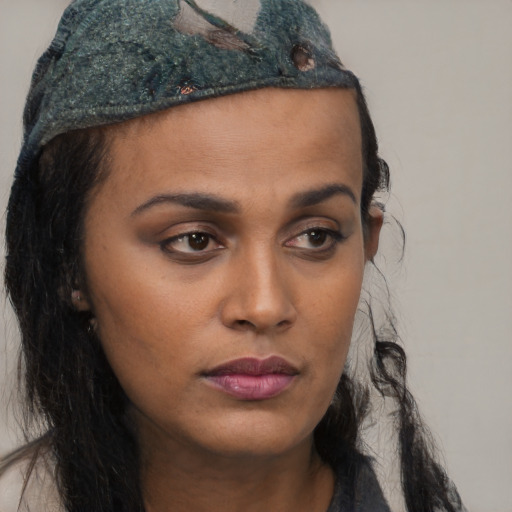 Neutral black young-adult female with long  brown hair and brown eyes