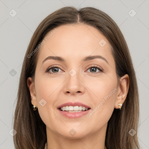 Joyful white adult female with long  brown hair and brown eyes