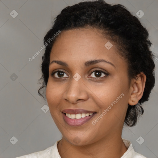 Joyful black young-adult female with medium  brown hair and brown eyes