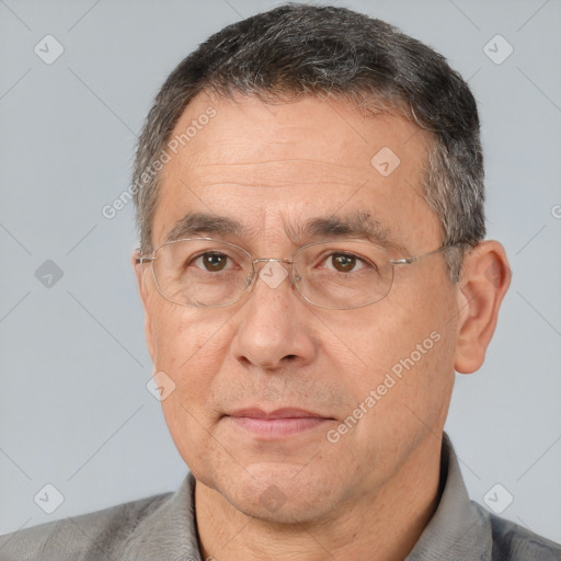 Joyful white middle-aged male with short  brown hair and brown eyes