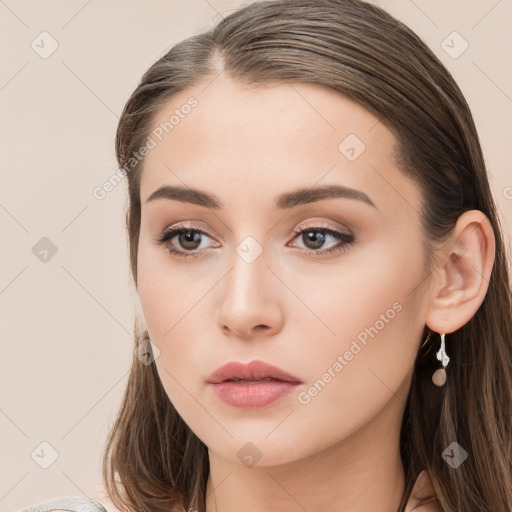 Neutral white young-adult female with long  brown hair and brown eyes