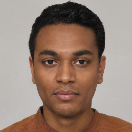 Neutral black young-adult male with short  black hair and brown eyes