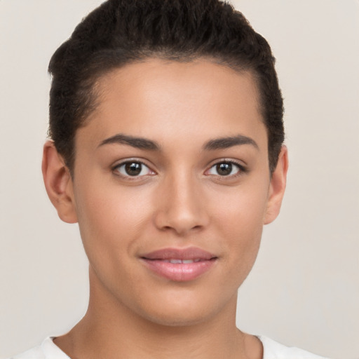 Joyful white young-adult female with short  brown hair and brown eyes