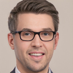 Joyful white adult male with short  brown hair and brown eyes