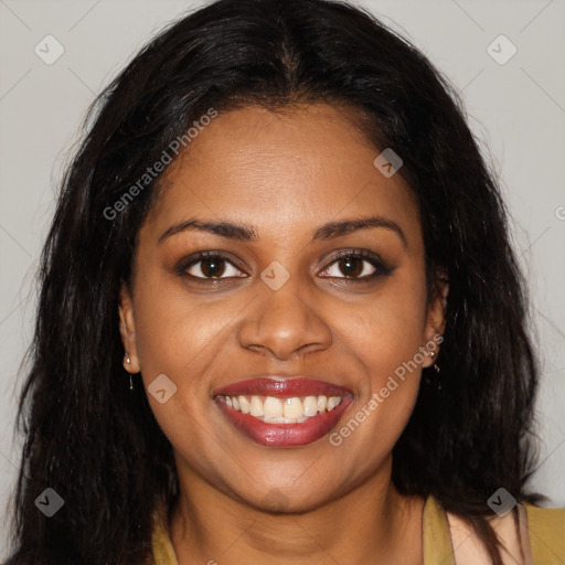 Joyful black young-adult female with long  brown hair and brown eyes