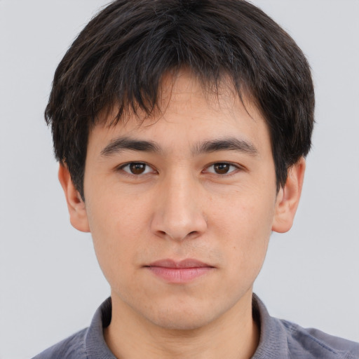 Neutral asian young-adult male with short  brown hair and brown eyes