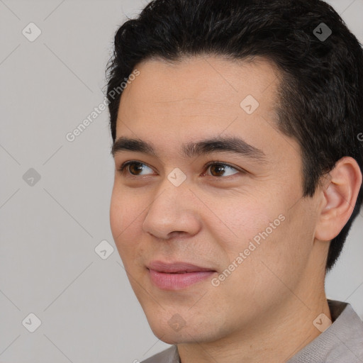 Joyful white young-adult male with short  black hair and brown eyes