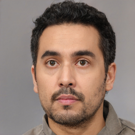 Neutral white young-adult male with short  black hair and brown eyes