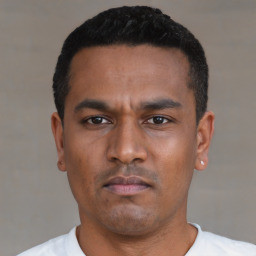 Neutral latino young-adult male with short  black hair and brown eyes