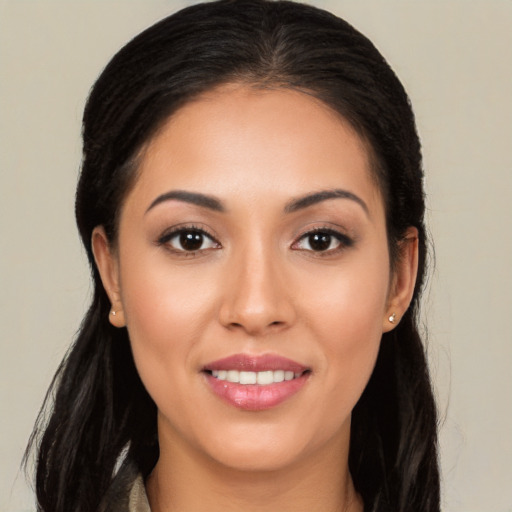 Joyful white young-adult female with long  brown hair and brown eyes