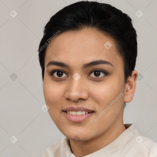 Joyful latino young-adult female with short  black hair and brown eyes