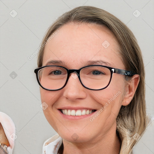 Joyful white adult female with medium  brown hair and blue eyes