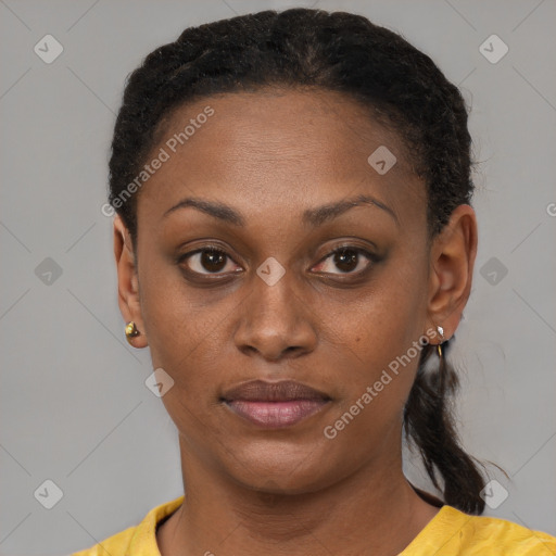 Joyful black young-adult female with short  brown hair and brown eyes