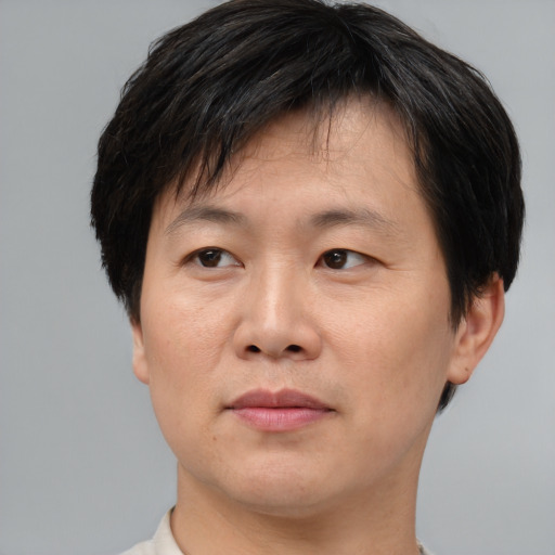 Neutral asian young-adult male with short  brown hair and brown eyes
