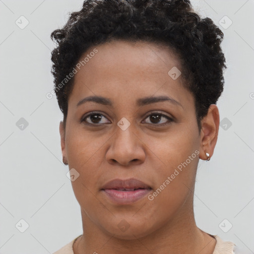 Joyful black young-adult female with short  brown hair and brown eyes