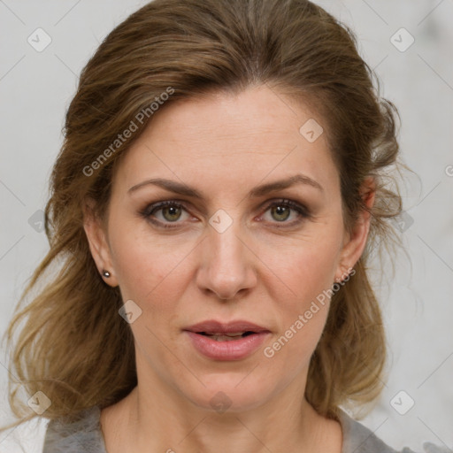 Joyful white adult female with medium  brown hair and grey eyes