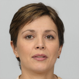 Joyful white adult female with short  brown hair and brown eyes