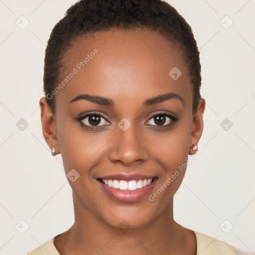 Joyful black young-adult female with short  brown hair and brown eyes